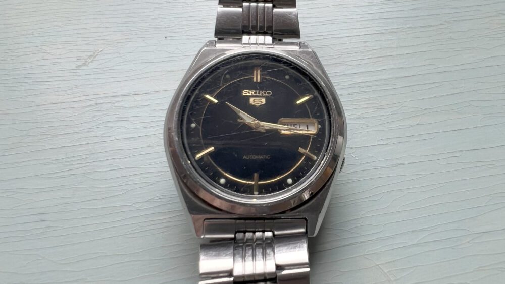 The author's first grown-up watch, a SEIKO 5 SNXG65 Automatic. 