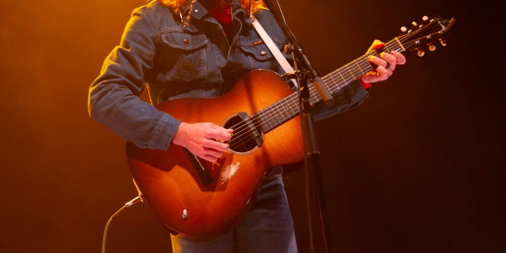 Jesse Welles playing a Rockbridge guitar on stage at The Danforth Music Hall in Toronto