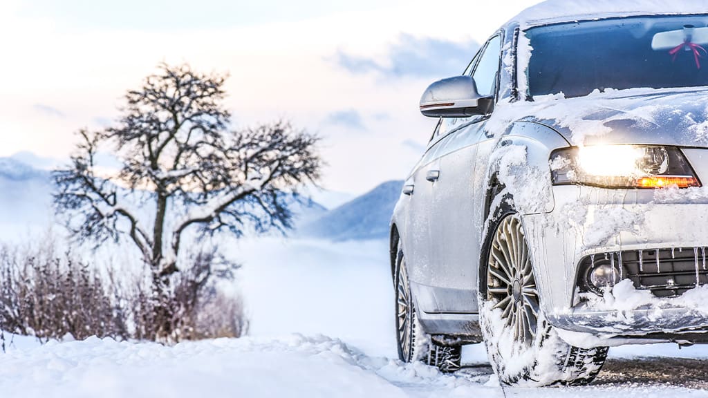 Winter Tire Myths: BUSTED (What You NEED to Know for 2025/2026) ice and snow covered car in winter setting